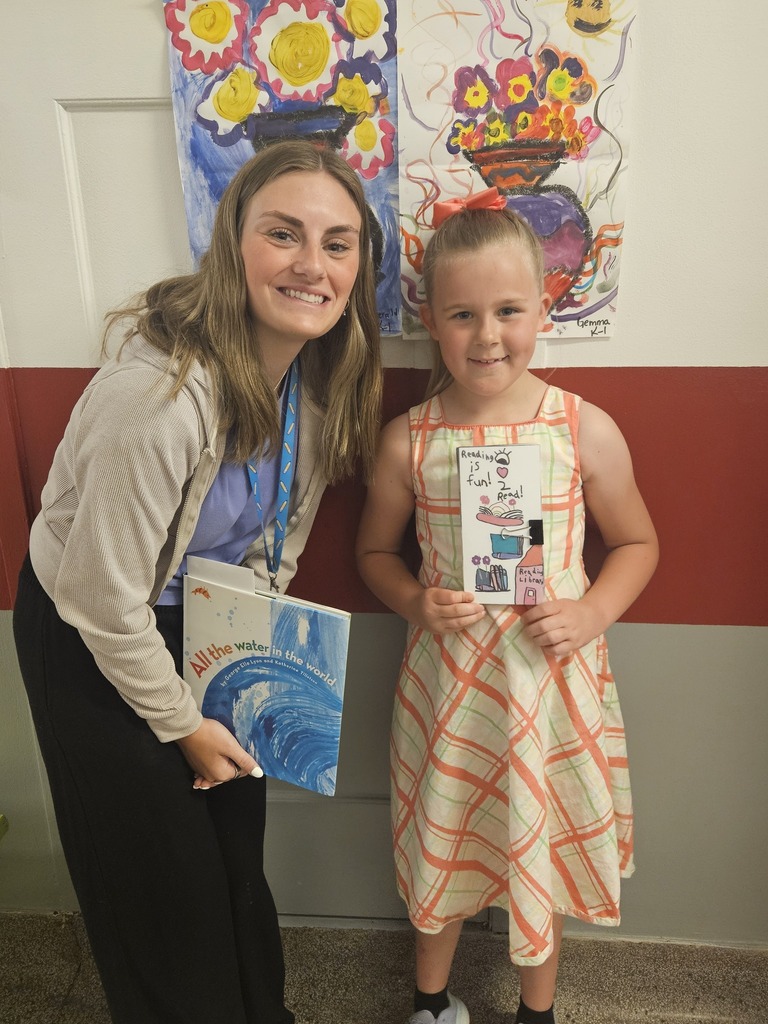A teacher and student smiling
