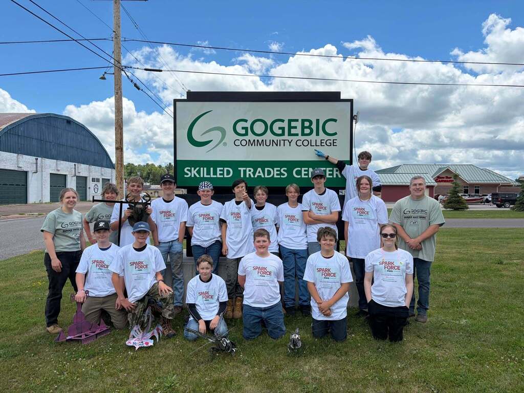 CTE-GCC Summer Welding Camp group picture. Children in front of GCC Skilled Trades Center sign