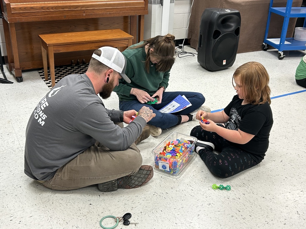 A family working at a math station