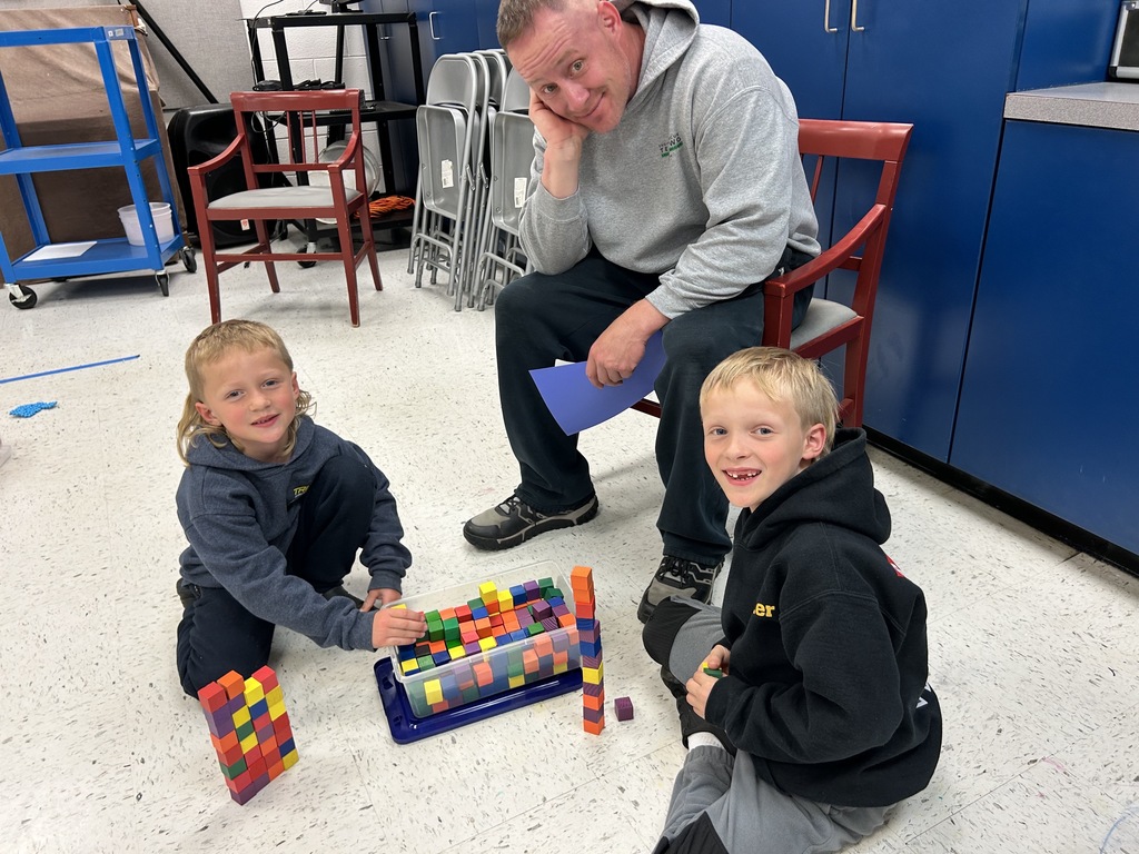 A family working at a math station