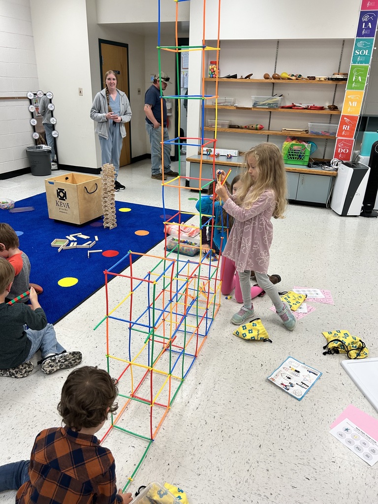 Students building structures out of straws