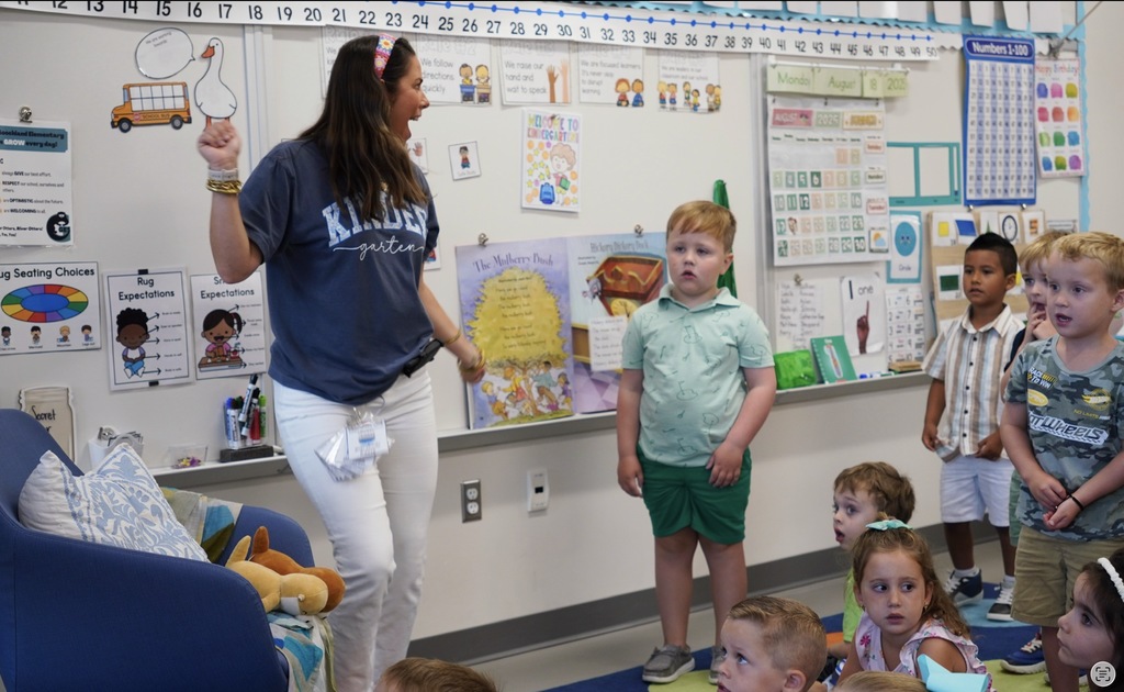 Teacher and students dancing