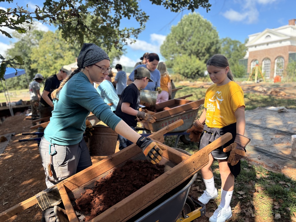 Student listening to an archeologist 