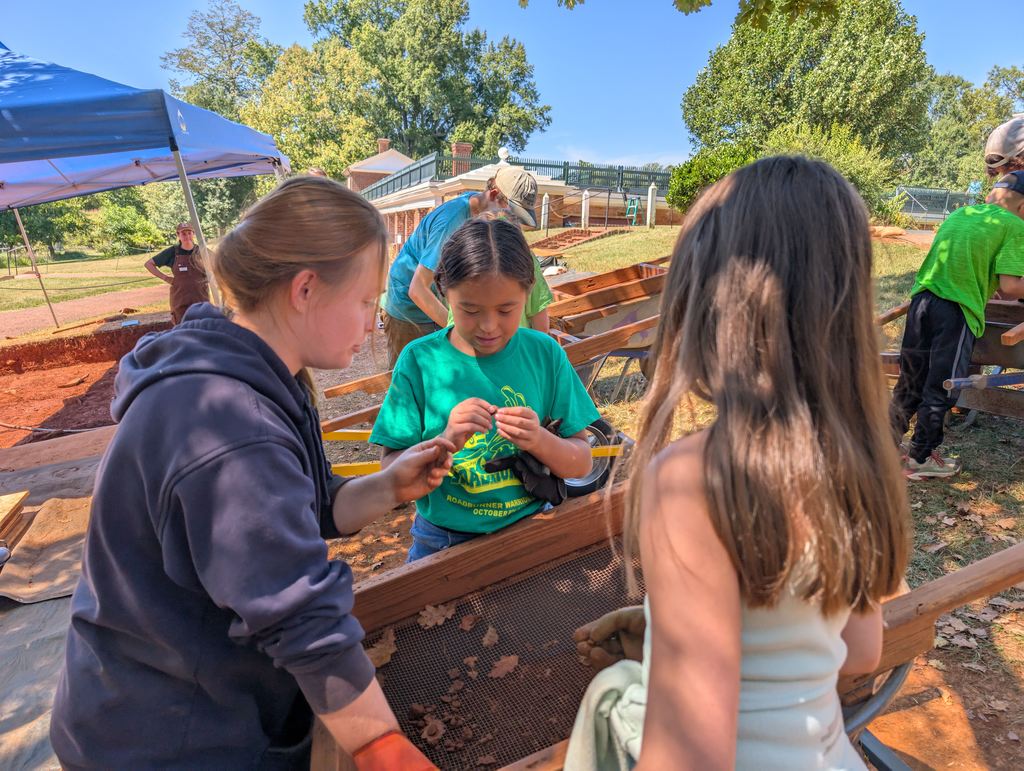 Students looking through artifacts 