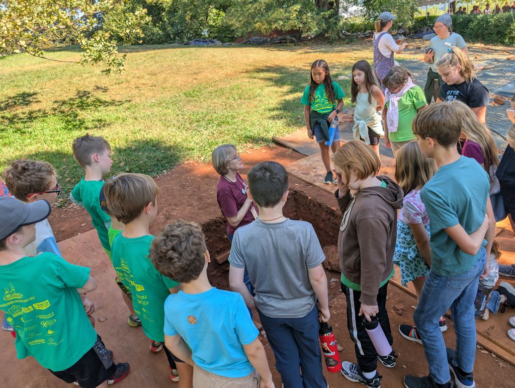 Students listening to an adult speak