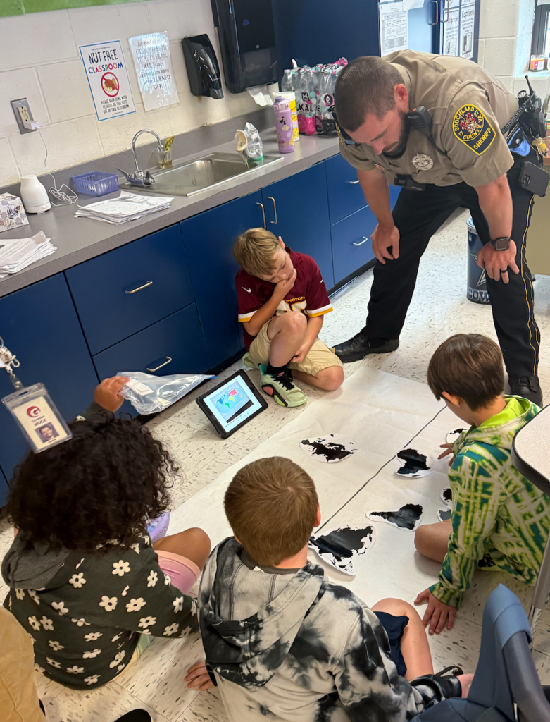 Officer Donithan always likes to get in on the learning fun!
