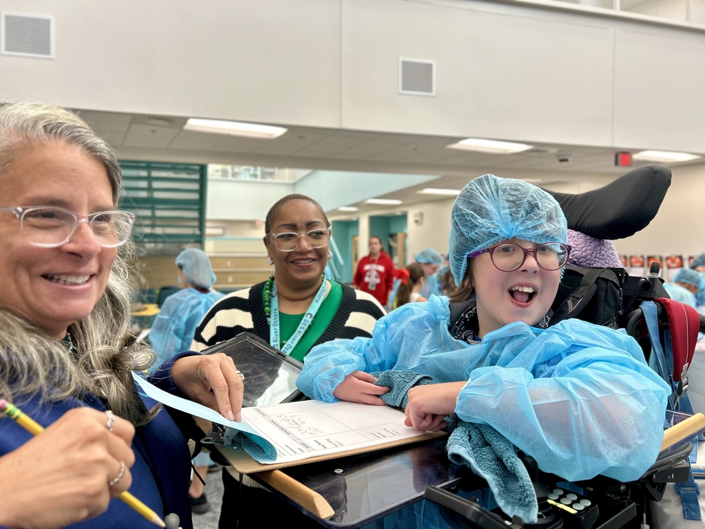 Student and teacher smiling