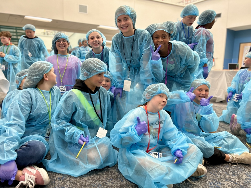 Group of students dressed as doctors posing for a picture