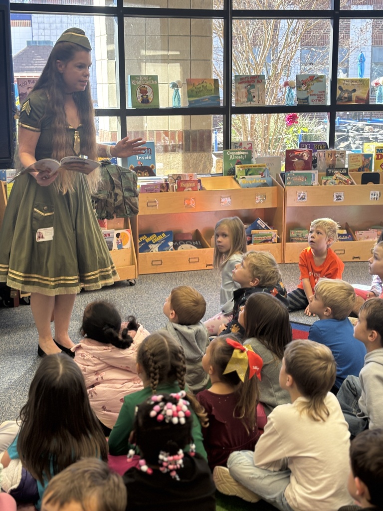 Christine Fauver dressed as a Bomber girl and sharing stories.