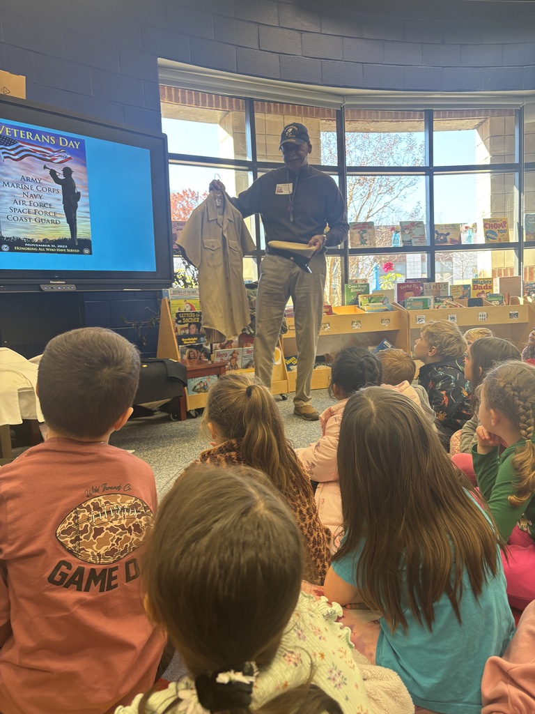 Mr.  Meyers showing off his different uniforms.