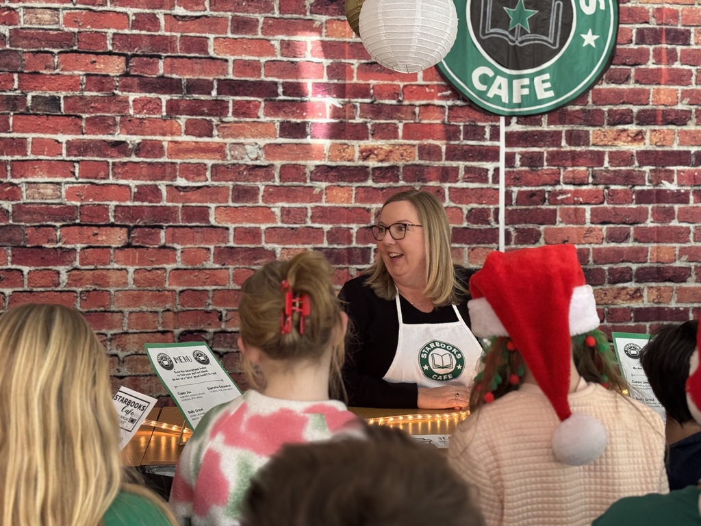 Mrs. Allen with students at Starbooks Cafe