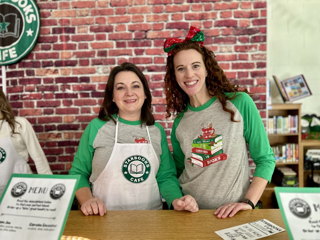 Mrs. Vaughan and Mrs. Eastwood smiling at Starbooks Cafe