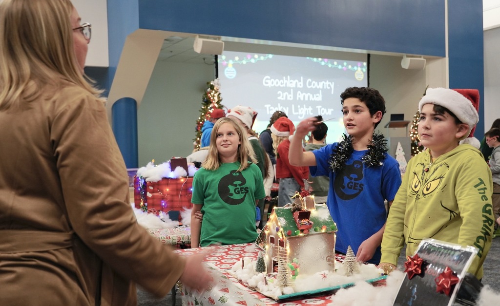 Three students explaining their project 