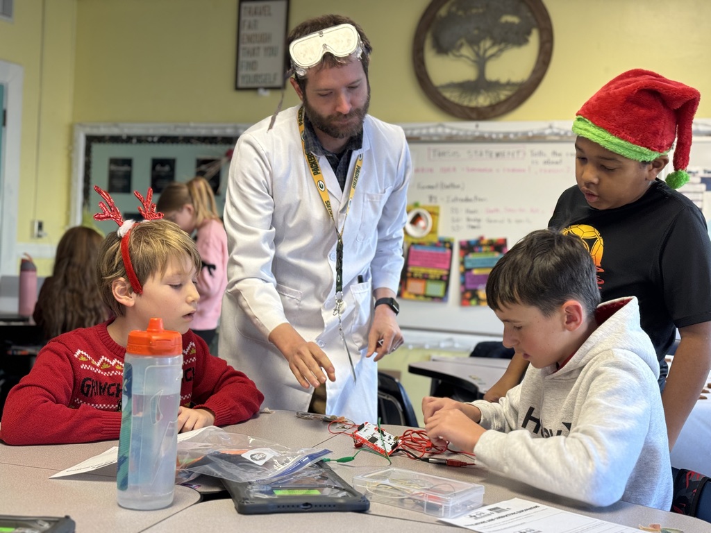 Mr. Mock working with a group of students