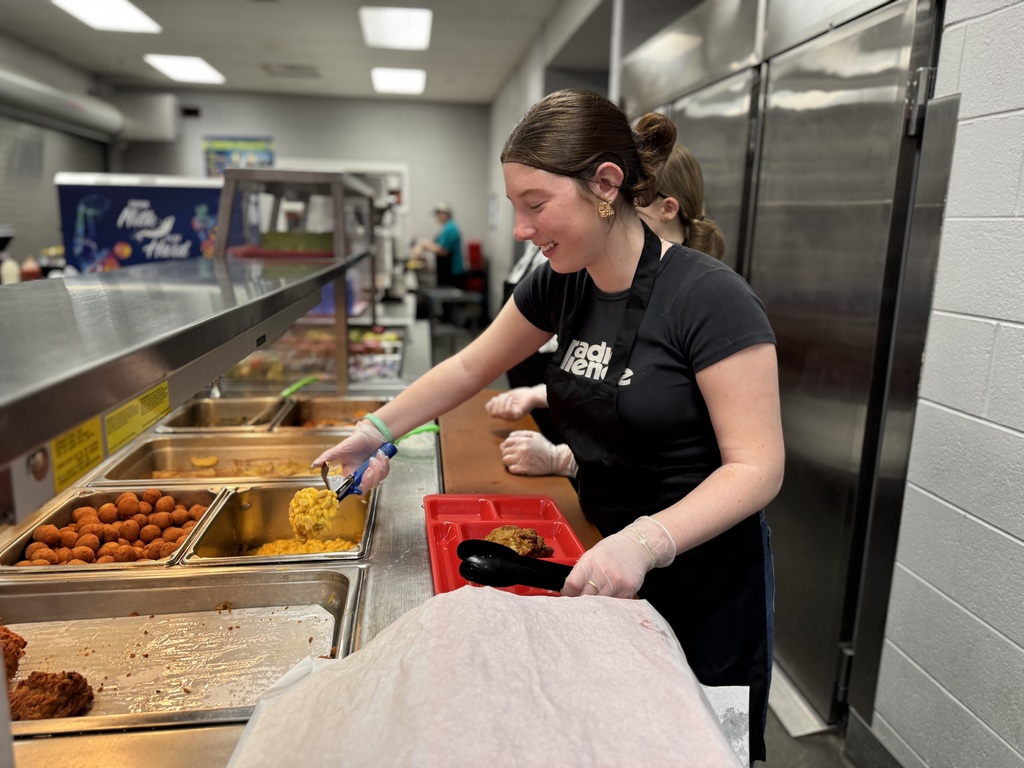 Student serving food