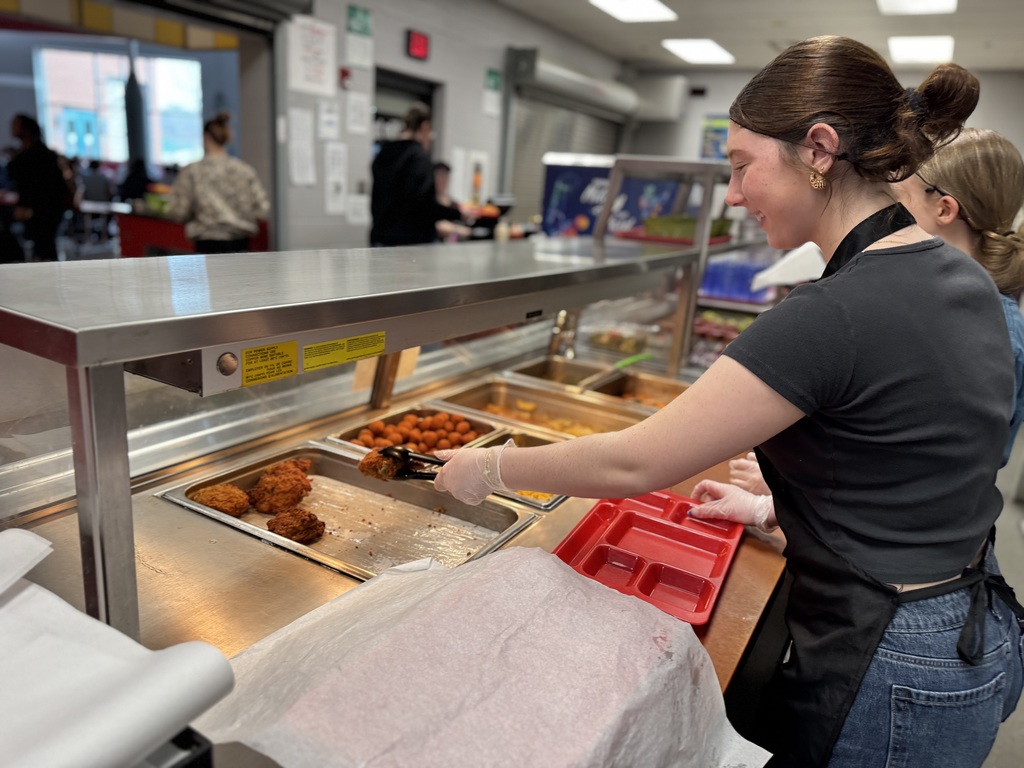 Student serving food