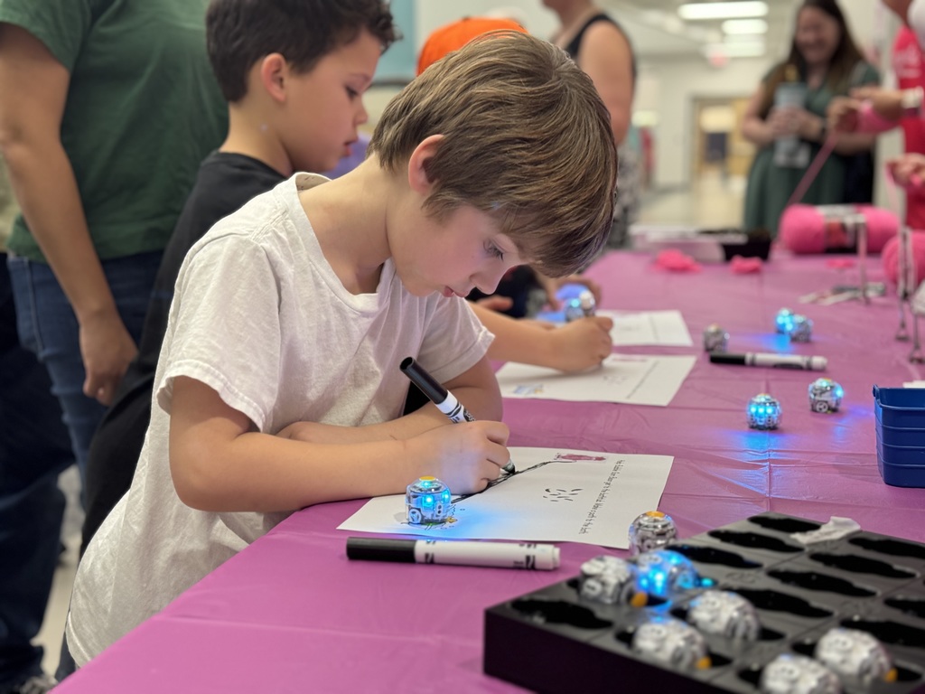 Student coding an Ozobot