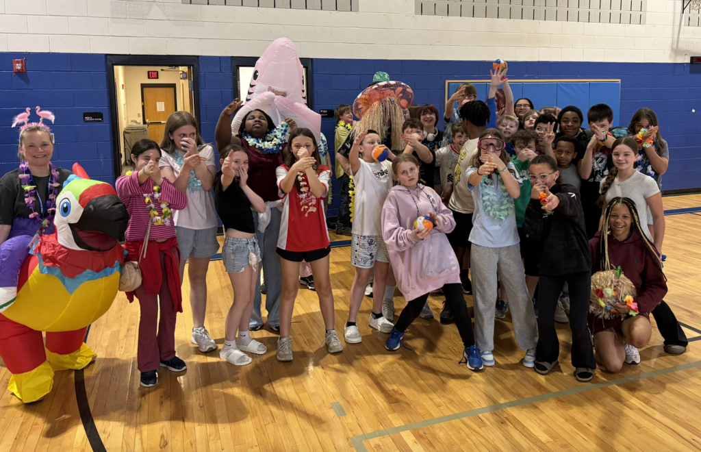 A group of students with Ms. Blackley, Mr. Singleton, and Mr. Gordon