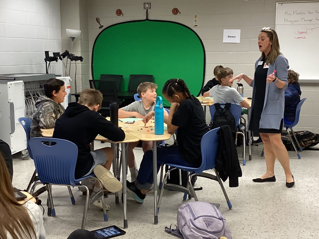 Woman explaining, students looking at her