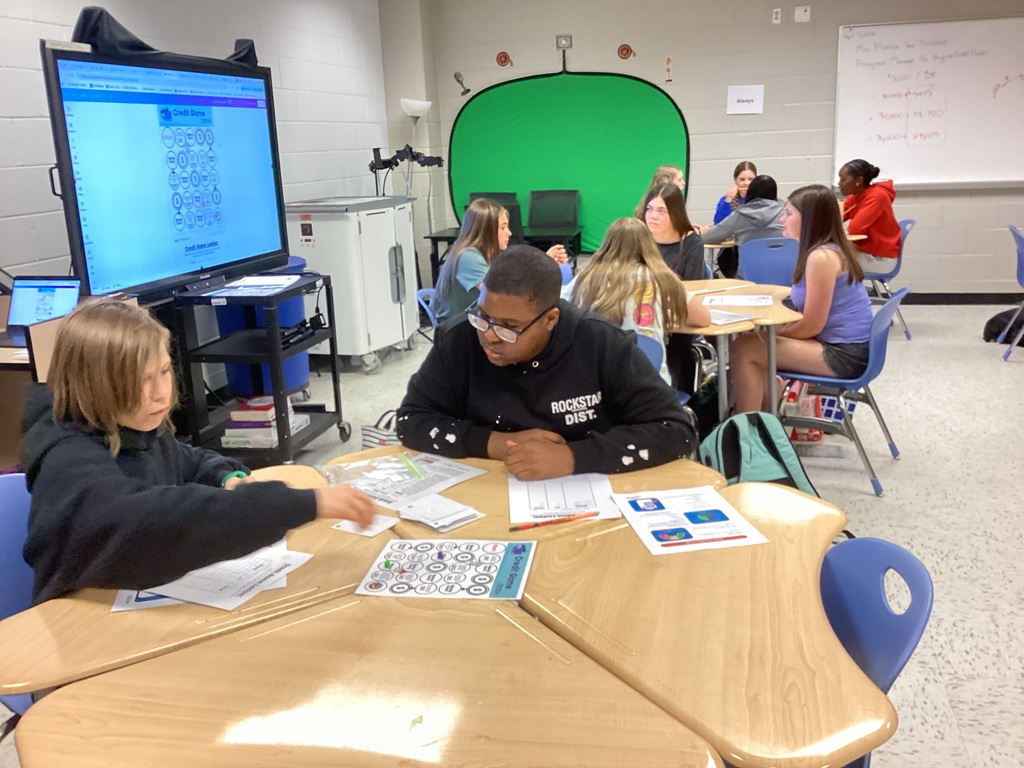 Students working on expenses activity