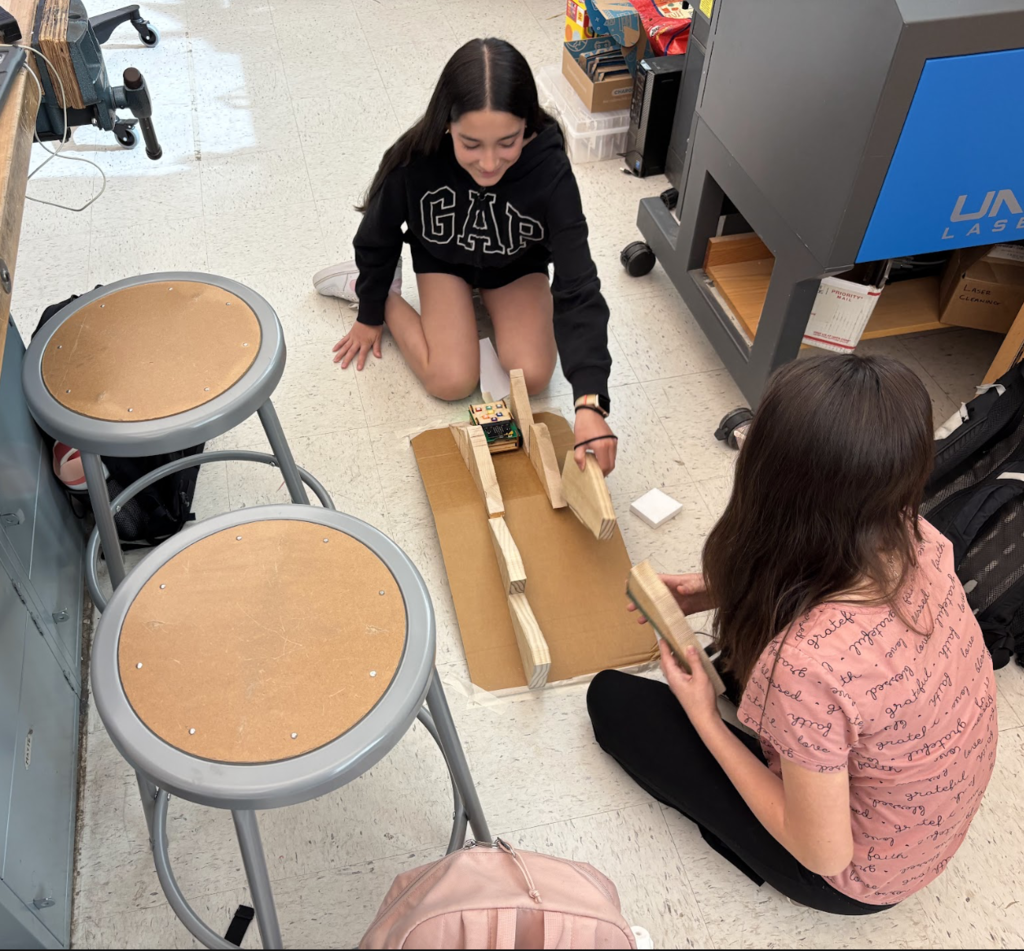 Students building ramp for Roversa robot
