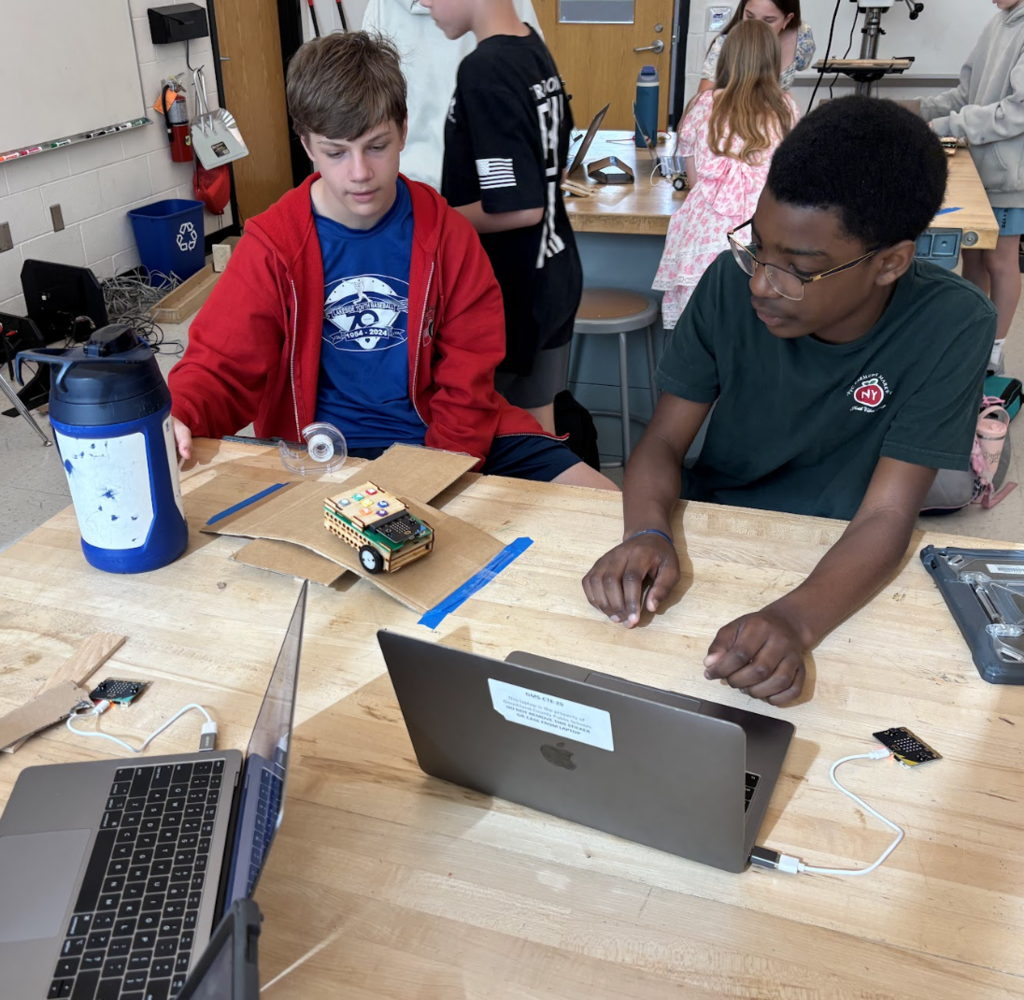 Students coding Roversa robot