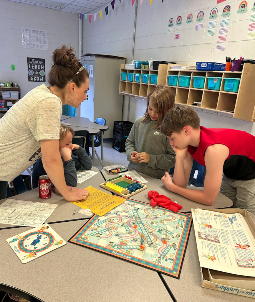 Families playing math games at math night.