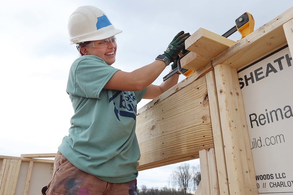 GHS graduate works on a Habitat for Humanity construction site