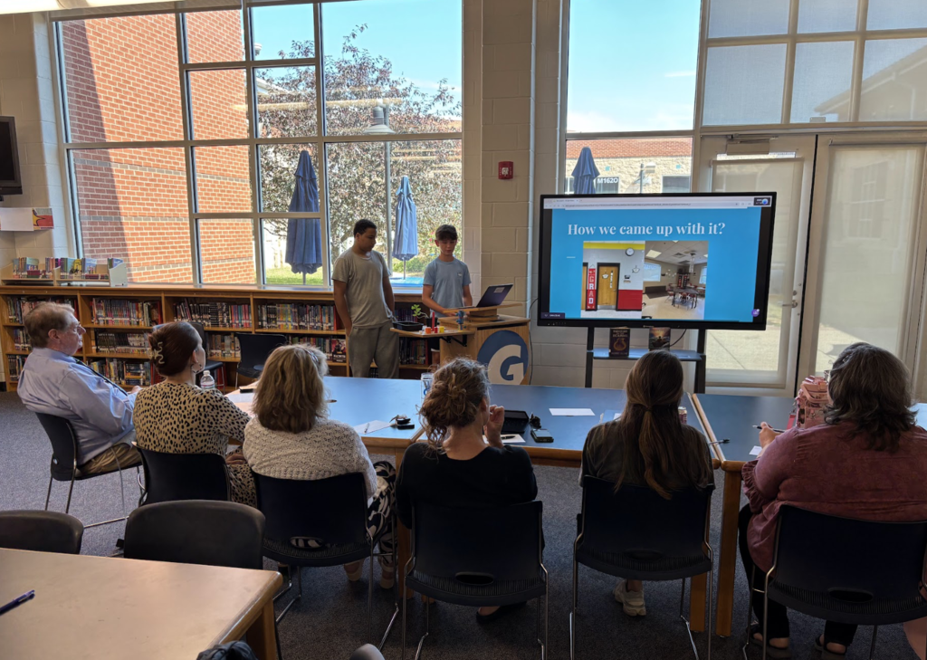 Students presenting in front of a panel of judges
