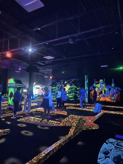 GMS Leadership team playing mini golf