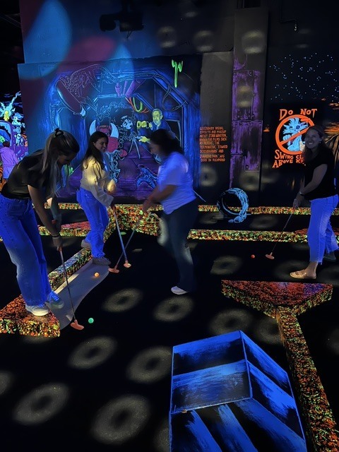 GMS Leadership team playing mini golf
