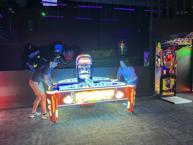 GMS Leadership team playing air hockey