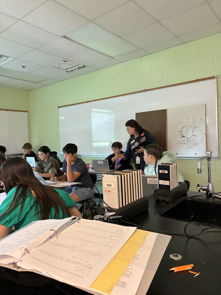 Ms. Raley assisting a student