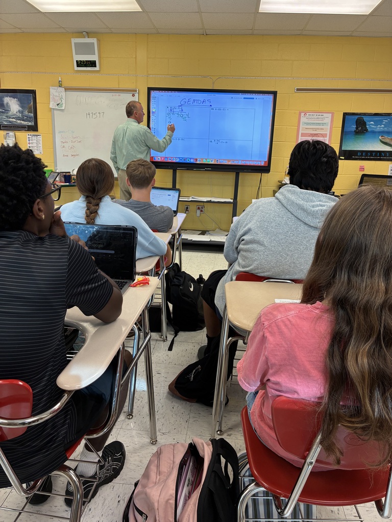 Mr. Gordon teaching at the board