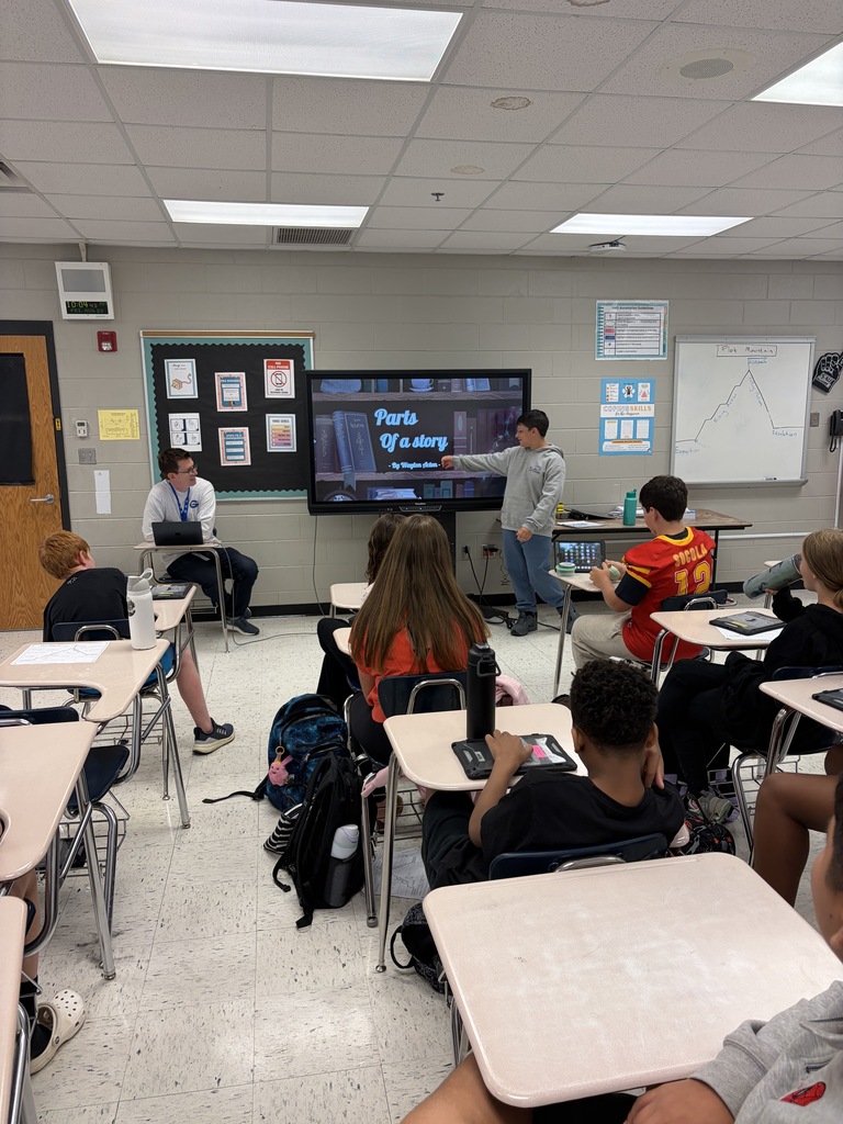 Student presenting about parts of a story to the class
