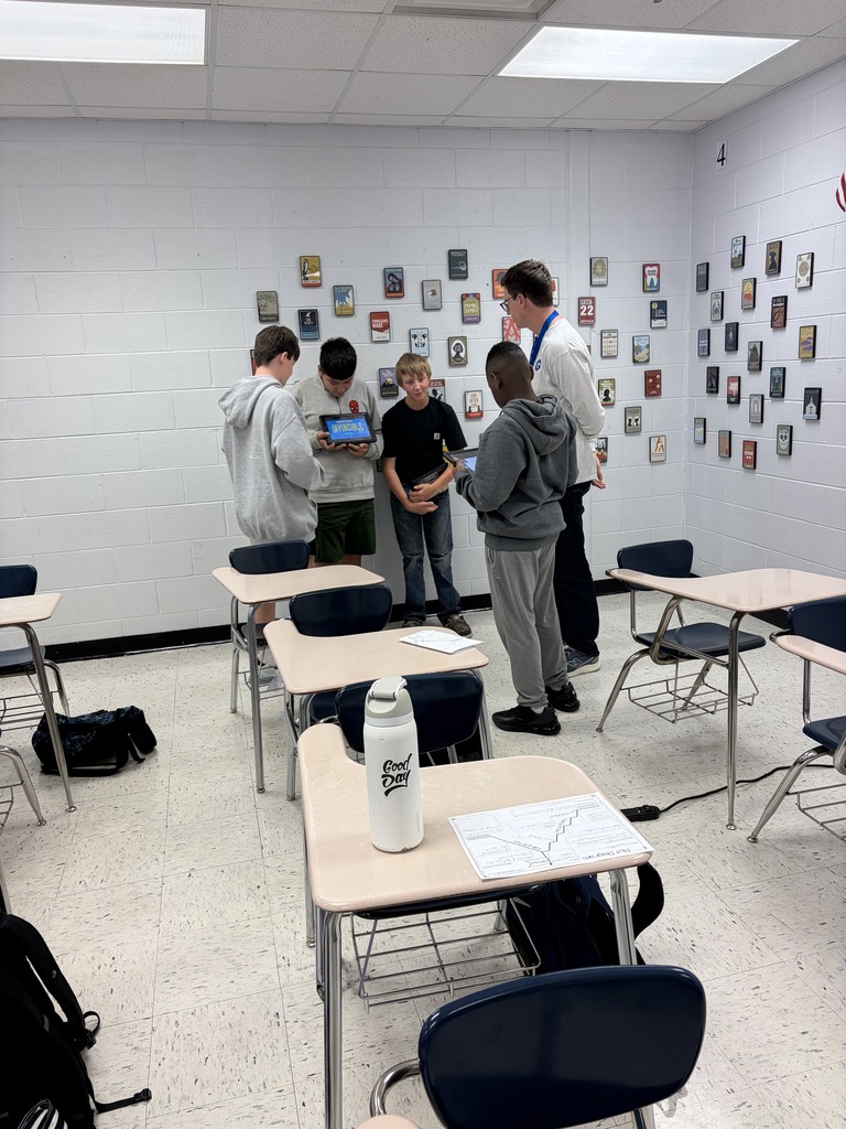 Mr. Lainson talking to a group of students