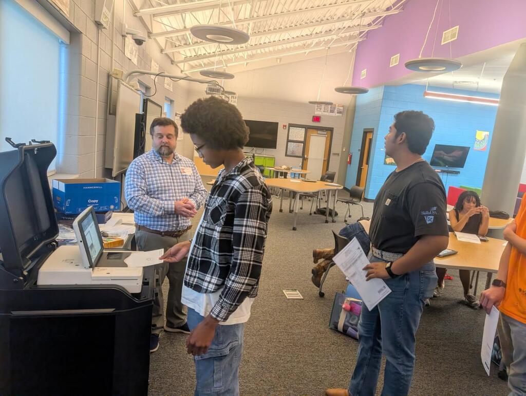Students casting practice ballots