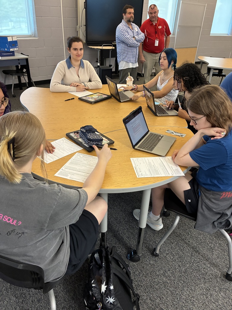 Students working on voter registration worksheets