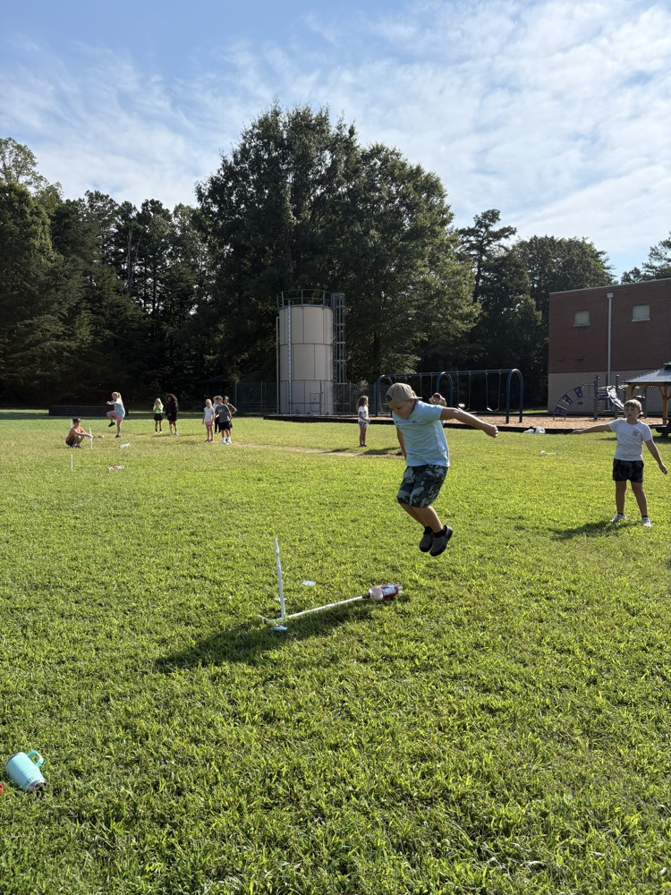 student blasting off the rocket