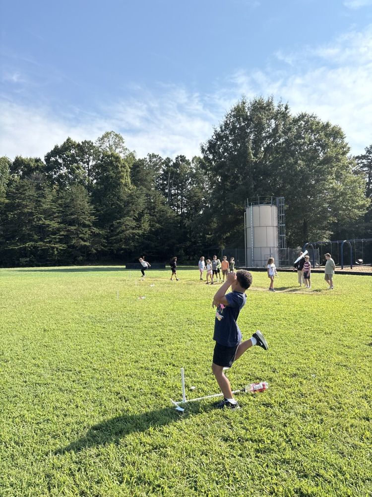 A student watching his rocket
