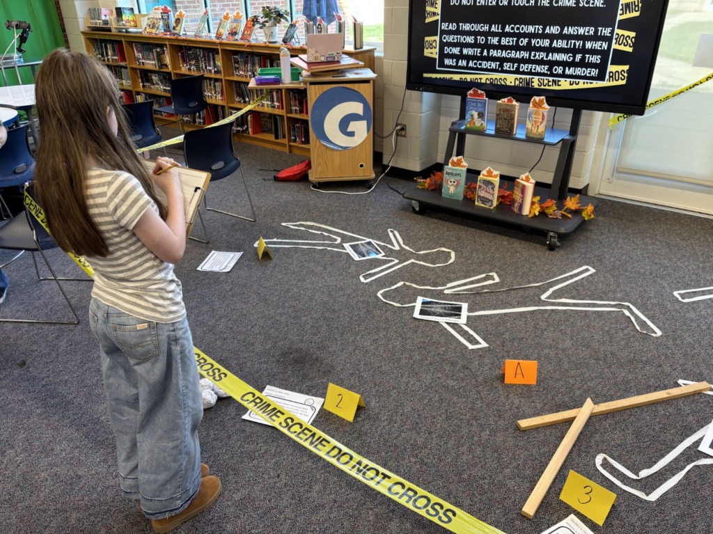 Students analyze the "crime scene" looking for clues