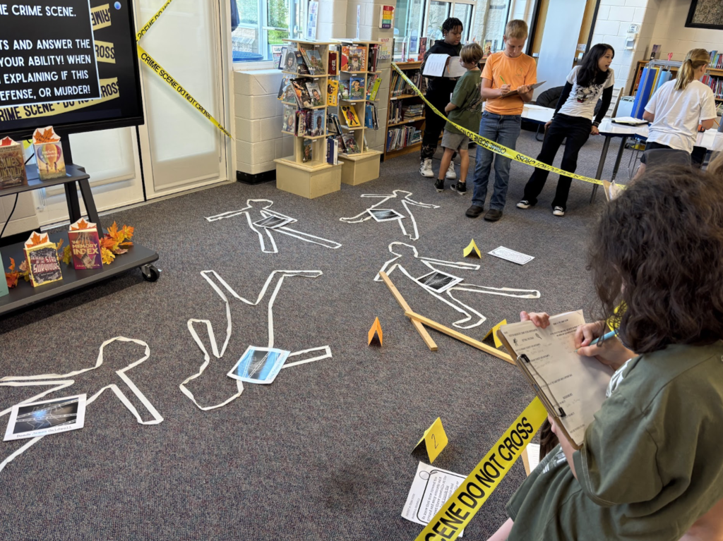 Students analyze the "crime scene" looking for clues