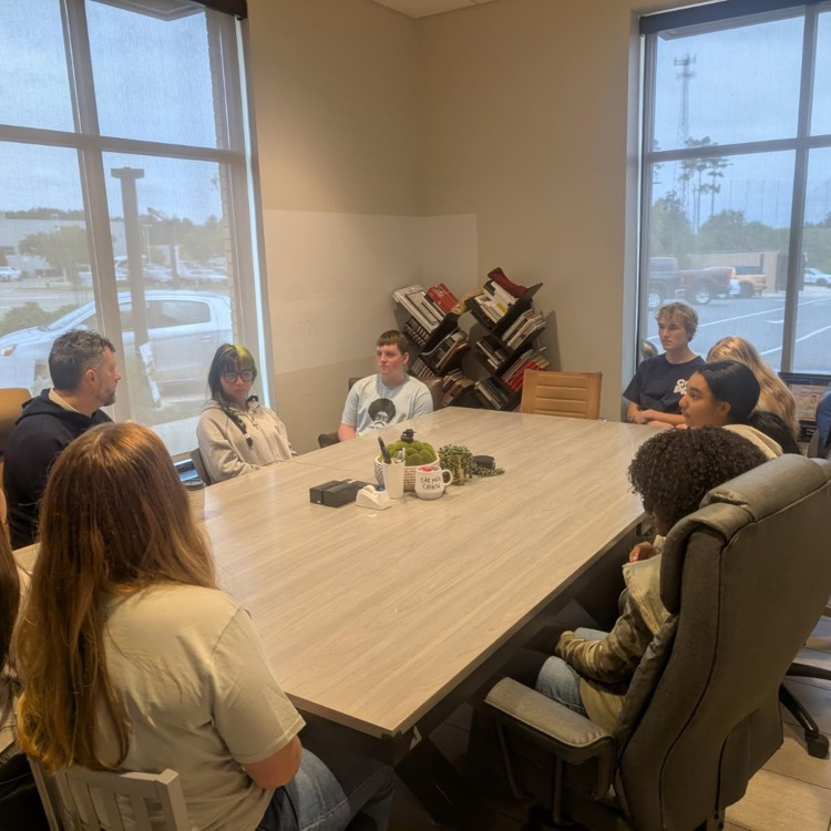 students sitting together at a table 