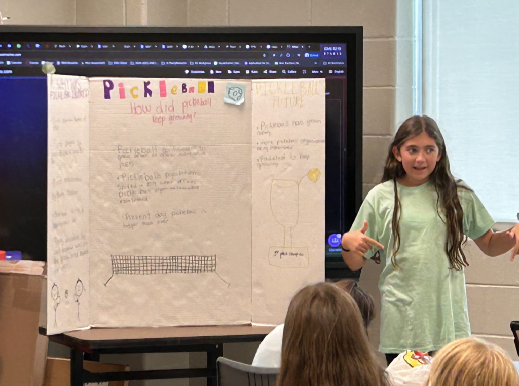 Student presenting their trifold
