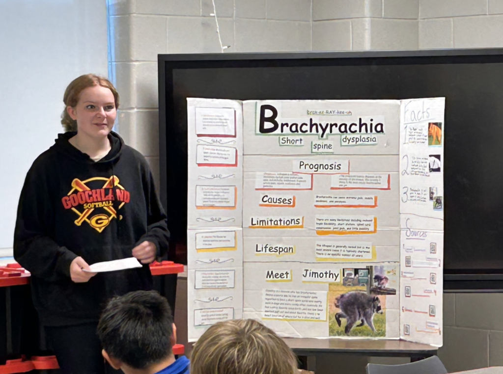 Student presenting their trifold
