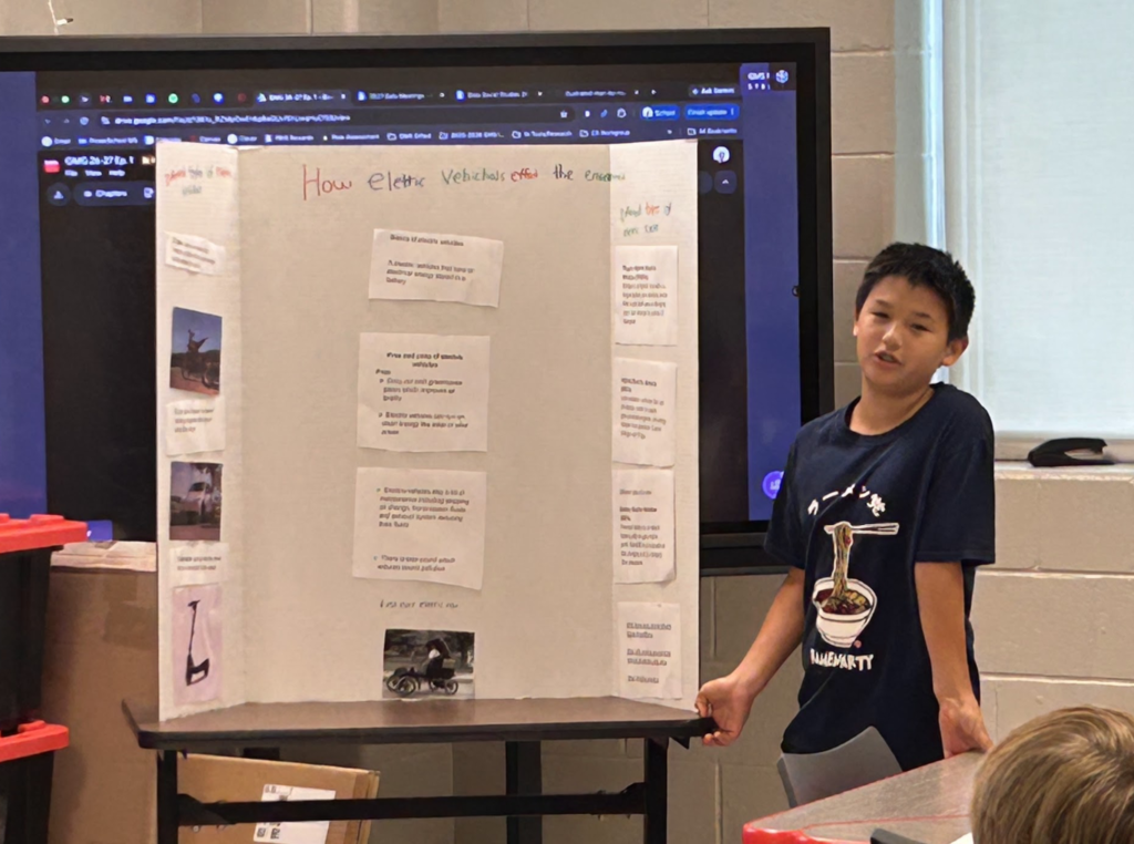 Student presenting their trifold