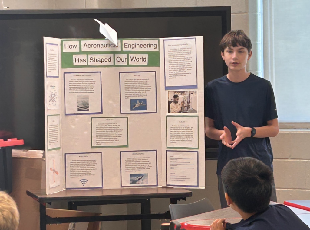 Student presenting their trifold