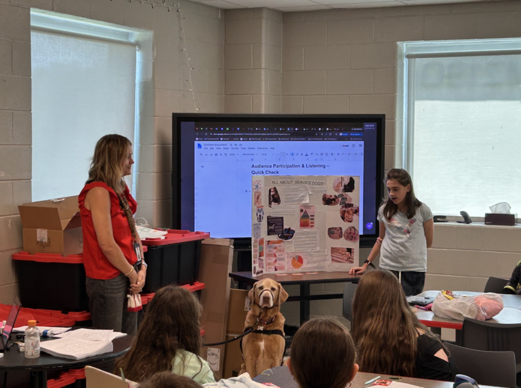 Student presenting their trifold