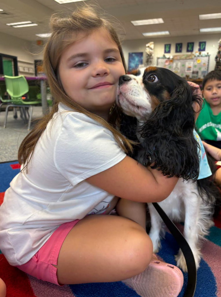 Student hugging Dawson