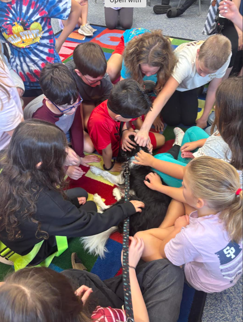 5th graders petting Dawson